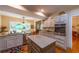 Modern kitchen with granite countertops, stainless steel appliances, and a cozy breakfast nook at 3833 Savannah E Sq, Atlanta, GA 30340