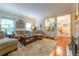 Inviting living room with a bar area, large windows, and comfortable seating at 3833 Savannah E Sq, Atlanta, GA 30340