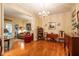 Elegant living room with hardwood floors, a chandelier, and comfortable seating area at 3833 Savannah E Sq, Atlanta, GA 30340