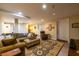 Finished basement living room with recessed lighting, a large sofa, and an area rug at 3833 Savannah E Sq, Atlanta, GA 30340