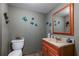 Contemporary powder room featuring decorative wall art, and an updated vanity at 3833 Savannah E Sq, Atlanta, GA 30340