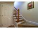 Staircase leading to another level, featuring carpeted steps and a wooden railing at 3833 Savannah E Sq, Atlanta, GA 30340