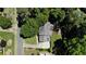 Aerial view of a well-maintained home, a leafy yard, and a pool surrounded by mature trees at 3837 Fenway Xing, Marietta, GA 30062