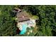 Aerial view showcasing the community pool area, complete with a pool, hot tub, and ample seating for residents at 3837 Fenway Xing, Marietta, GA 30062