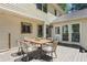 Back deck with patio table, four chairs, siding, and sliding glass doors to the home at 3837 Fenway Xing, Marietta, GA 30062