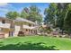 Expansive backyard featuring a deck, stairs up a rockery hill, lush lawn, and mature trees providing privacy at 3837 Fenway Xing, Marietta, GA 30062