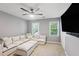 Bonus room with neutral colored walls, carpeted floors, lots of pillows, and a wall-mounted TV at 3837 Fenway Xing, Marietta, GA 30062