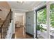 Welcoming foyer with hardwood floors, staircase, and a view of the dining room at 3837 Fenway Xing, Marietta, GA 30062