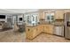 Open-concept kitchen featuring tile floors, stainless steel appliances, and a breakfast area at 3837 Fenway Xing, Marietta, GA 30062