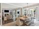Living room with a fireplace, built-in shelving, tile floors, and ample seating at 3837 Fenway Xing, Marietta, GA 30062