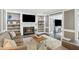 Cozy living room featuring a fireplace, built-in shelves, and a comfortable seating area at 3837 Fenway Xing, Marietta, GA 30062