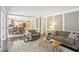 Cozy living room with hardwood floors and a view of the open kitchen and dining area at 3837 Fenway Xing, Marietta, GA 30062