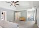 Spacious Primary bedroom with tray ceilings, ceiling fan, and an ensuite bathroom at 3837 Fenway Xing, Marietta, GA 30062
