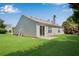 Home featuring a well maintained lawn, slider and a rear facade with neutral siding at 424 Yellow River Walk, Lawrenceville, GA 30043