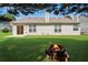 Home with a fire pit on a lawn, features a backyard great for relaxing at 424 Yellow River Walk, Lawrenceville, GA 30043