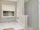 Bathroom featuring a soaking tub and separate shower at 424 Yellow River Walk, Lawrenceville, GA 30043