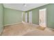 Green bedroom with an ensuite bathroom and two closets at 424 Yellow River Walk, Lawrenceville, GA 30043