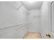 Walk-in closet with built-in shelving providing ample storage space at 424 Yellow River Walk, Lawrenceville, GA 30043