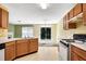 A traditionally styled kitchen leading to sliding doors and a view of the backyard at 424 Yellow River Walk, Lawrenceville, GA 30043