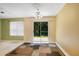Bright breakfast area with sliding glass doors and neutral flooring at 424 Yellow River Walk, Lawrenceville, GA 30043