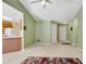 Open-concept living area connects to the kitchen, featuring neutral walls and carpet at 424 Yellow River Walk, Lawrenceville, GA 30043
