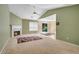 Spacious living room with a fireplace, vaulted ceilings, and sliding glass door to the outside at 424 Yellow River Walk, Lawrenceville, GA 30043