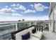 A beautiful balcony with cushioned chairs provides relaxation and amazing views at 45 Ivan Allen Jr Blvd # 2203, Atlanta, GA 30308