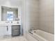 Elegant bathroom features a soaking tub, sleek vanity, and clean, modern lines at 45 Ivan Allen Jr Blvd # 2203, Atlanta, GA 30308