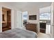 This bedroom boasts access to the bathroom and the kitchen, creating a cohesive living space at 45 Ivan Allen Jr Blvd # 2203, Atlanta, GA 30308