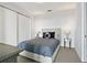 Cozy bedroom with tufted headboard, accent pillows, and modern mirrored nightstands at 45 Ivan Allen Jr Blvd # 2203, Atlanta, GA 30308