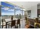 Dining area with city views, stainless steel appliances, and hardwood flooring at 45 Ivan Allen Jr Blvd # 2203, Atlanta, GA 30308