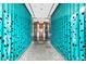 Unique entrance with decorative turquoise panels leading to a sophisticated doorway at 45 Ivan Allen Jr Blvd # 2203, Atlanta, GA 30308
