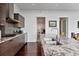 Modern kitchen featuring granite countertops, stainless steel appliances, and dark wood cabinets at 45 Ivan Allen Jr Blvd # 2203, Atlanta, GA 30308