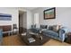 Inviting living room featuring hardwood floors, a comfortable couch, and stylish decor at 45 Ivan Allen Jr Blvd # 2203, Atlanta, GA 30308