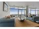 Bright living room with floor to ceiling windows and an outdoor terrace to enjoy the city views at 45 Ivan Allen Jr Blvd # 2203, Atlanta, GA 30308