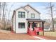 Attractive two-story home showcasing a combination of brick and siding, complemented by a charming front porch at 4041 Blanton Sw Ave, Atlanta, GA 30331