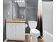 Bathroom features a single sink vanity with granite countertop and white cabinets at 5030 Mundy Dr, Cumming, GA 30028