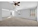 Spacious bedroom featuring high ceilings, fan, and bright natural light at 5030 Mundy Dr, Cumming, GA 30028