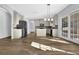 Spacious kitchen with stainless steel appliances, central island, and abundant natural light at 5030 Mundy Dr, Cumming, GA 30028