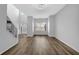 Open concept living room with hardwood floors and ample sunlight at 5030 Mundy Dr, Cumming, GA 30028