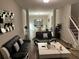 Inviting living room with a modern black and white theme and hardwood floors at 5030 Mundy Dr, Cumming, GA 30028