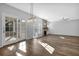 Spacious living room with hardwood floors, fireplace, and sliding glass doors at 5030 Mundy Dr, Cumming, GA 30028