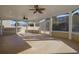 Screened in porch with ceiling fans, plenty of open space, and natural light at 5030 Mundy Dr, Cumming, GA 30028