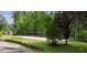 Spacious backyard with volleyball court and mature trees for outdoor fun at 625 W Lake Dr, Oxford, GA 30054