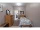 Cozy bedroom with neutral paint and trim, carpeted floor, and access to a full bathroom at 625 W Lake Dr, Oxford, GA 30054