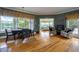 Dining room with scenic views, hardwood floors, and elegant decor at 625 W Lake Dr, Oxford, GA 30054