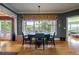 Bright dining area with lake views, hardwood floors, and comfortable seating at 625 W Lake Dr, Oxford, GA 30054