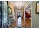 Inviting entryway with hardwood floors, chandelier lighting, and beautiful leaded glass sidelight at 625 W Lake Dr, Oxford, GA 30054
