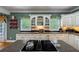 Well-equipped kitchen with granite counters and cabinetry, featuring under cabinet lighting at 625 W Lake Dr, Oxford, GA 30054