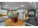 Spacious kitchen with granite countertops, stainless steel appliances, and center island at 625 W Lake Dr, Oxford, GA 30054